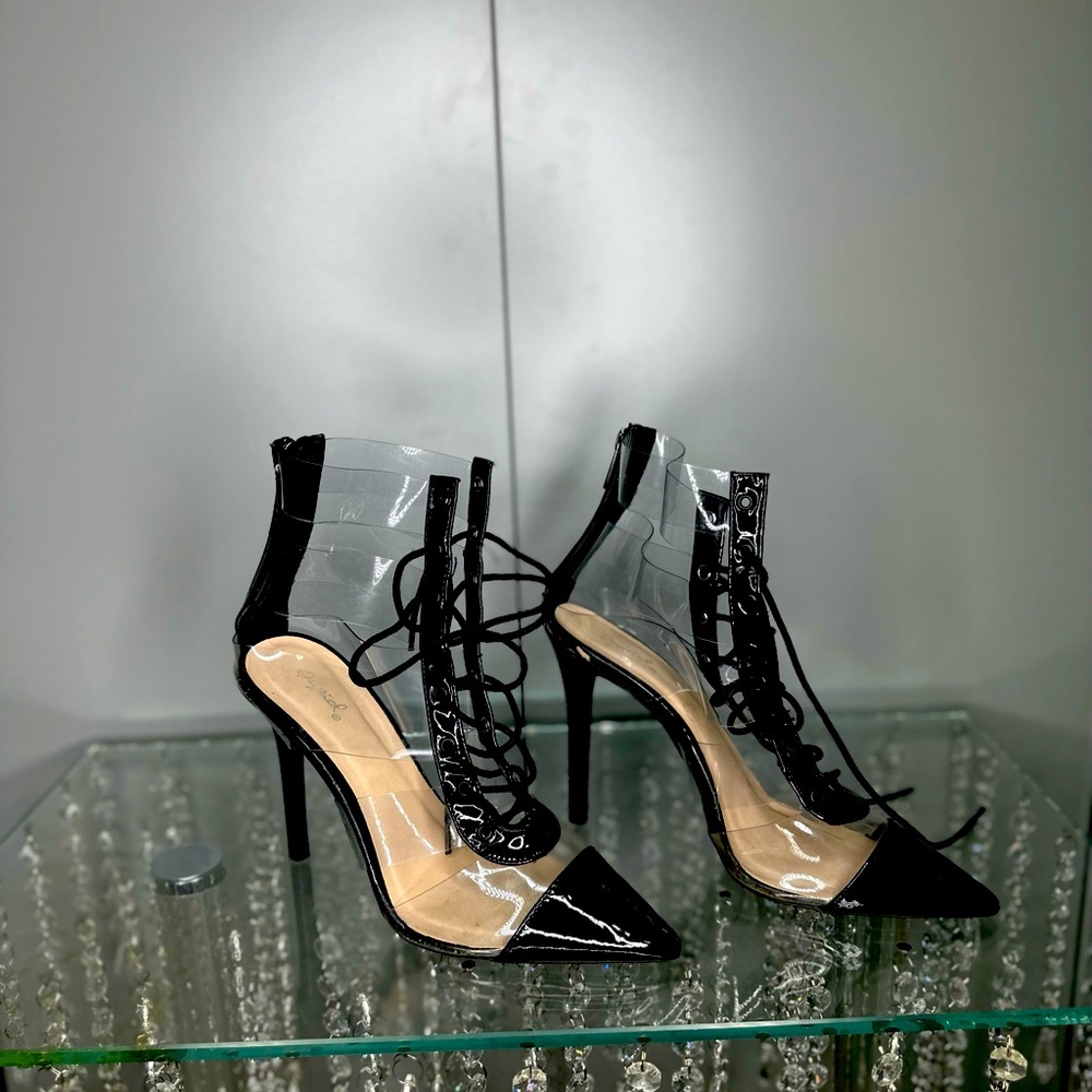 Beautiful black and clear tie woman boots. Size 9 but fits a size 8 better.
